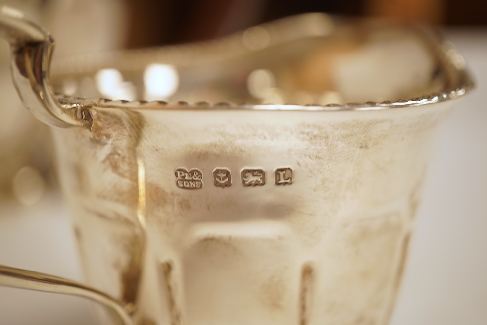 A George V three piece silver tea set by Pearce & Sons & Sons, Birmingham, 1935, gross weight 26.6oz.